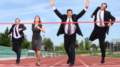ASX 300 share investors in suits running a race on an athletics track