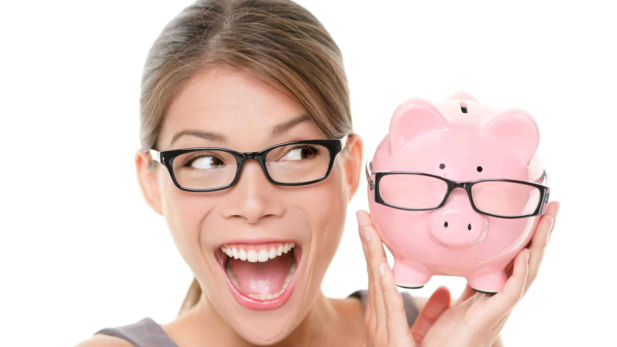 rising asx share price represented by smiling woman holding piggy bank