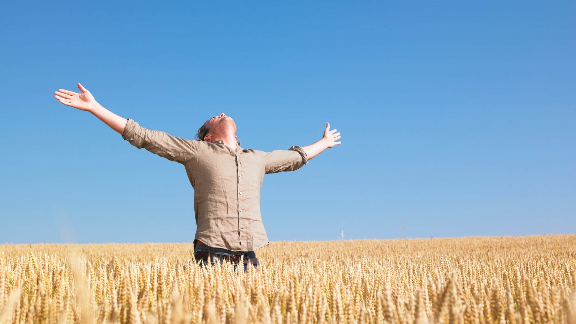 Graincorp share price farming asx share price rise represented by rejoicing farmer in field