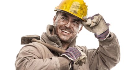 A happy miner tips his hard hat, indicating good ashare price results for ASX mining stocks