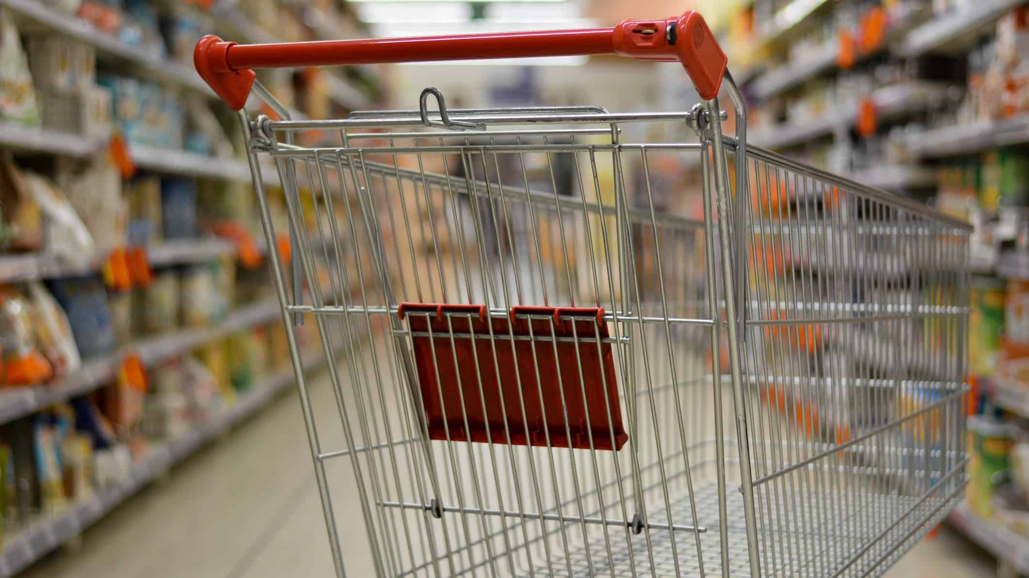 supermarket asx shares represented by shopping trolley in supermarket aisle