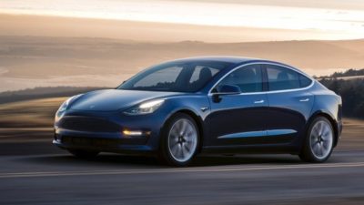 electric vehicle made by Tesla on the road.