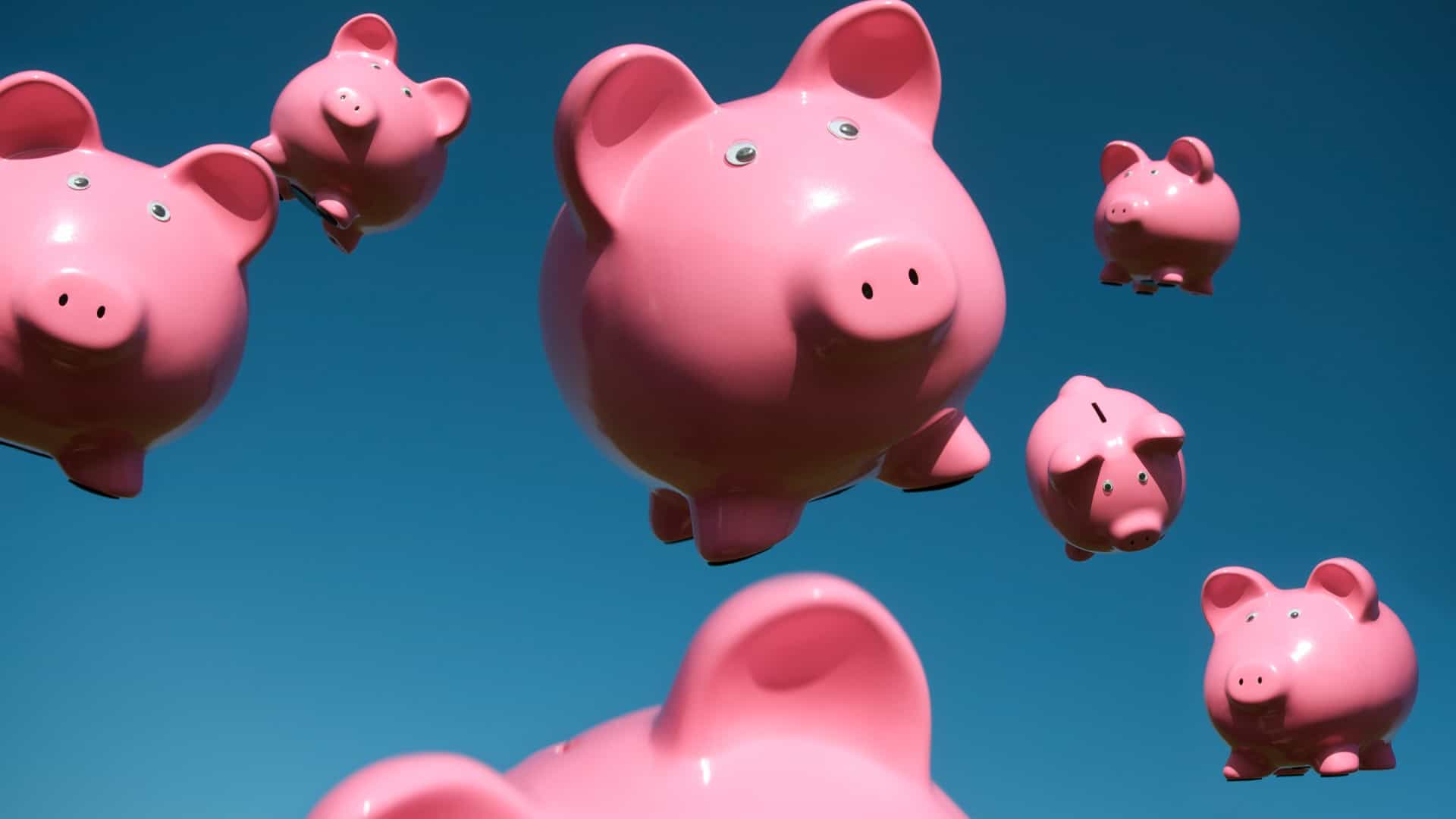 little pig piggy banks falling from the blue sky, indicating a windfall of income from ASX dividend shares