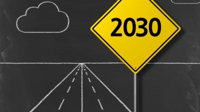 A chalkboard road with a yellow sign saying 2030, representing the way forward for ASX companies