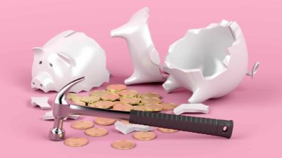 asx bank reporting season shares hammered by inflation represented by hammer next to broken piggy bank