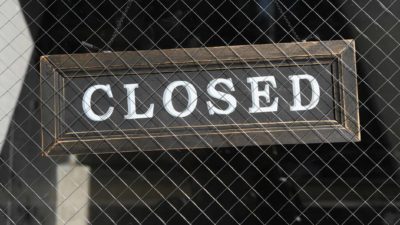 Closed sign on gate