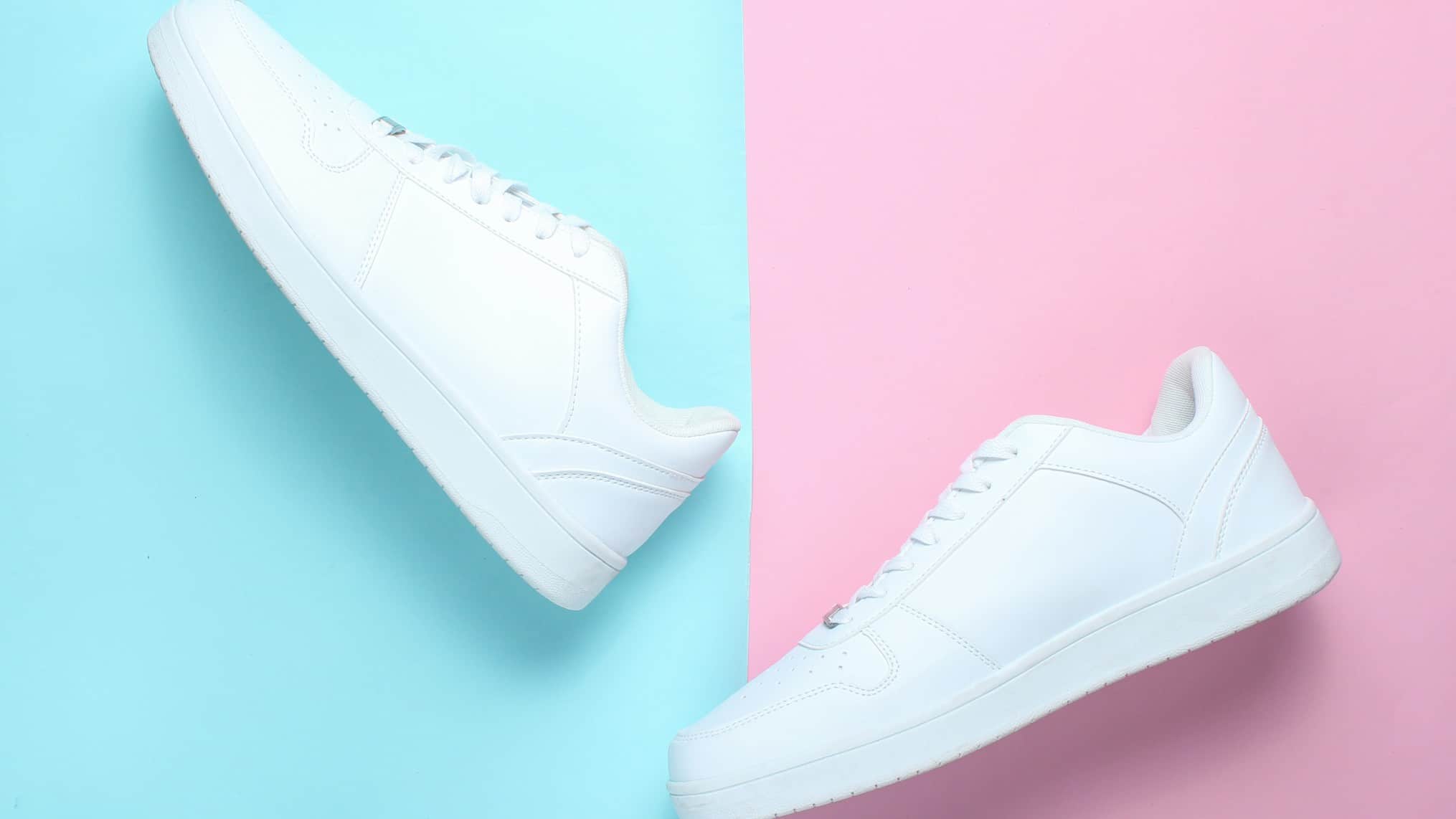 shoes asx share price represented by white shoes against pink and blue background AX1 share price downgrade