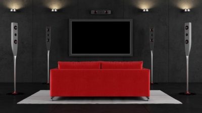 streaming shares represented by large tv on wall in front of red couch