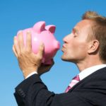 Deterra share price royalties top asx shares represented by investor kissing piggy bank