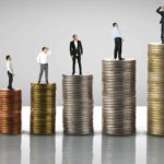 Stacks of coins in a row with each higher than the last, and a person standing on top of each one watching them grow.