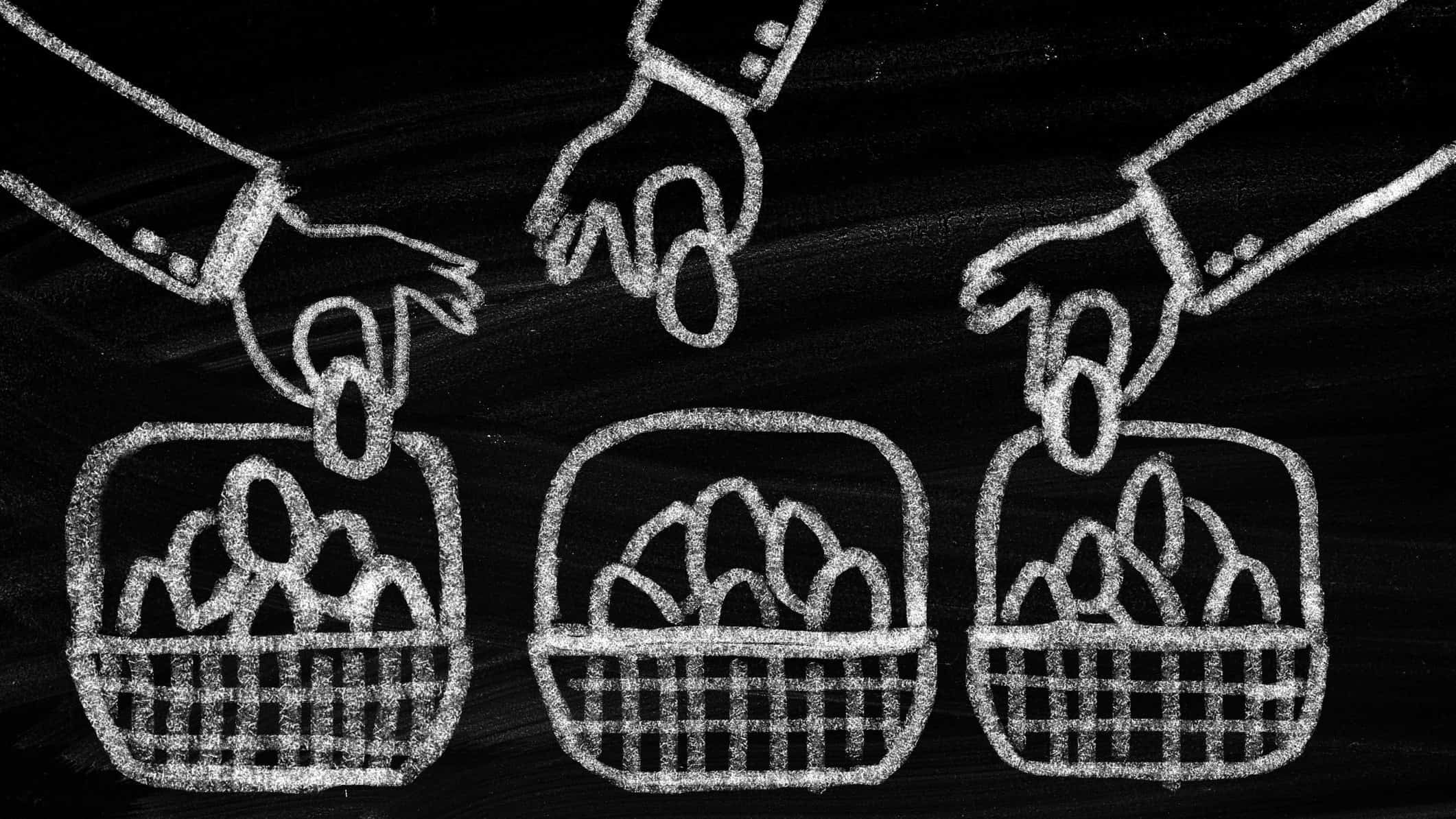 diversification through asx etf represented by chalk drawing of hands placing eggs in multiple baskets