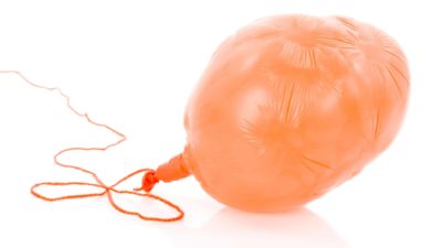 Slumping asx share price represented by half deflated balloon