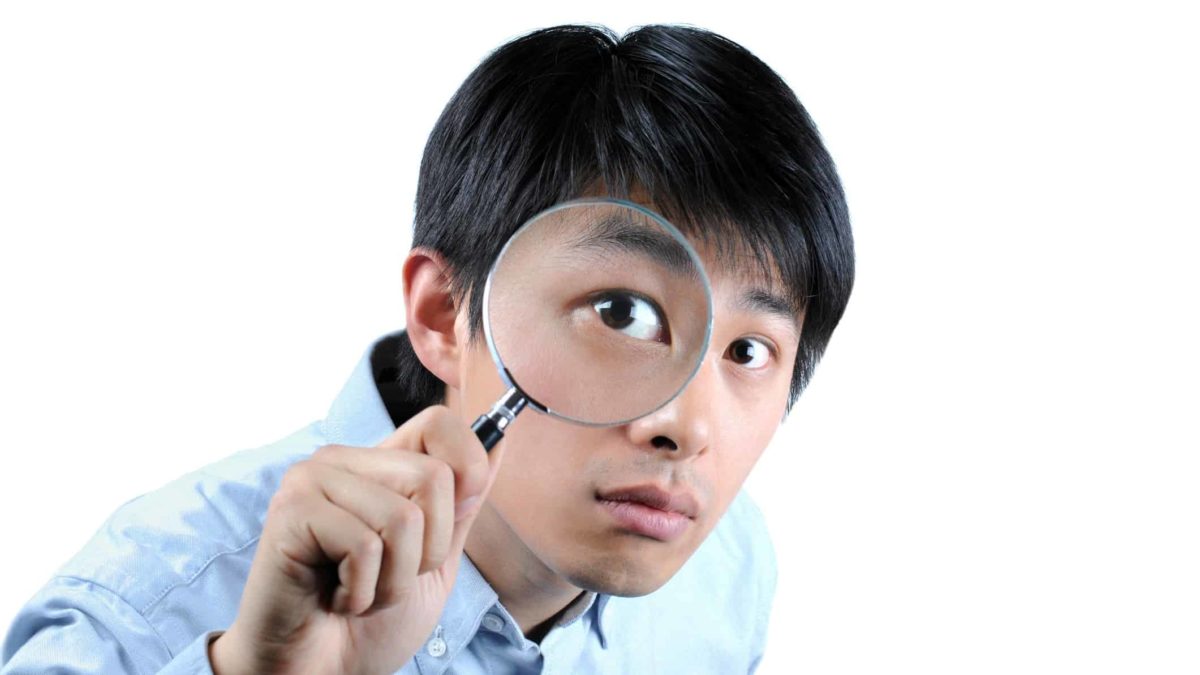 asx share price on watch represented by investor looking through magnifying glass