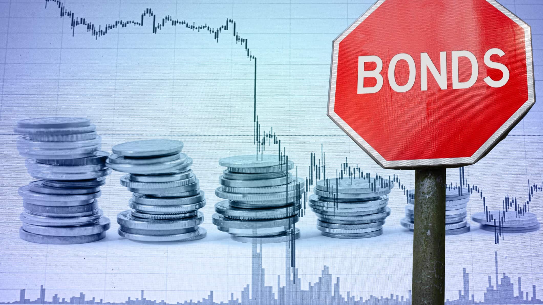 A stop sign with the word bonds in front of a crashing market