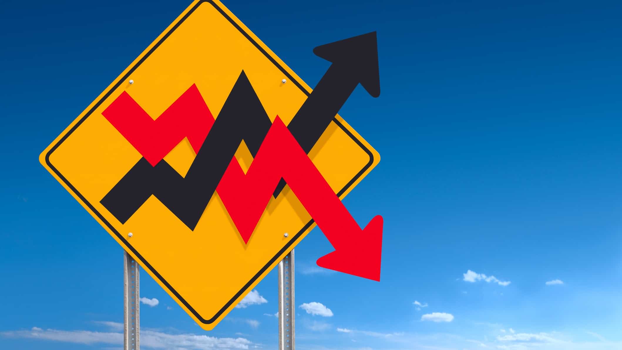 A yellow warning sign with black and red arrows going up and down, indicating ASX share market chaos
