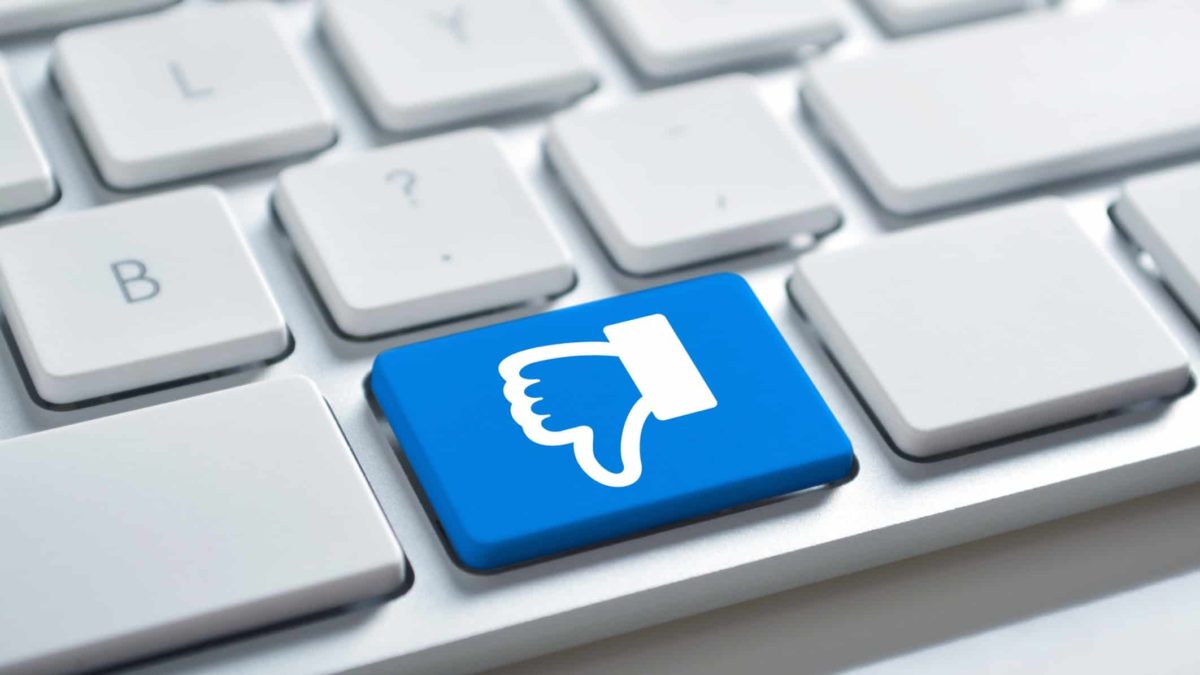 Thumbs down Facebook icon on a computer keyboard, indicating backlash against facebook's news ban in Australia