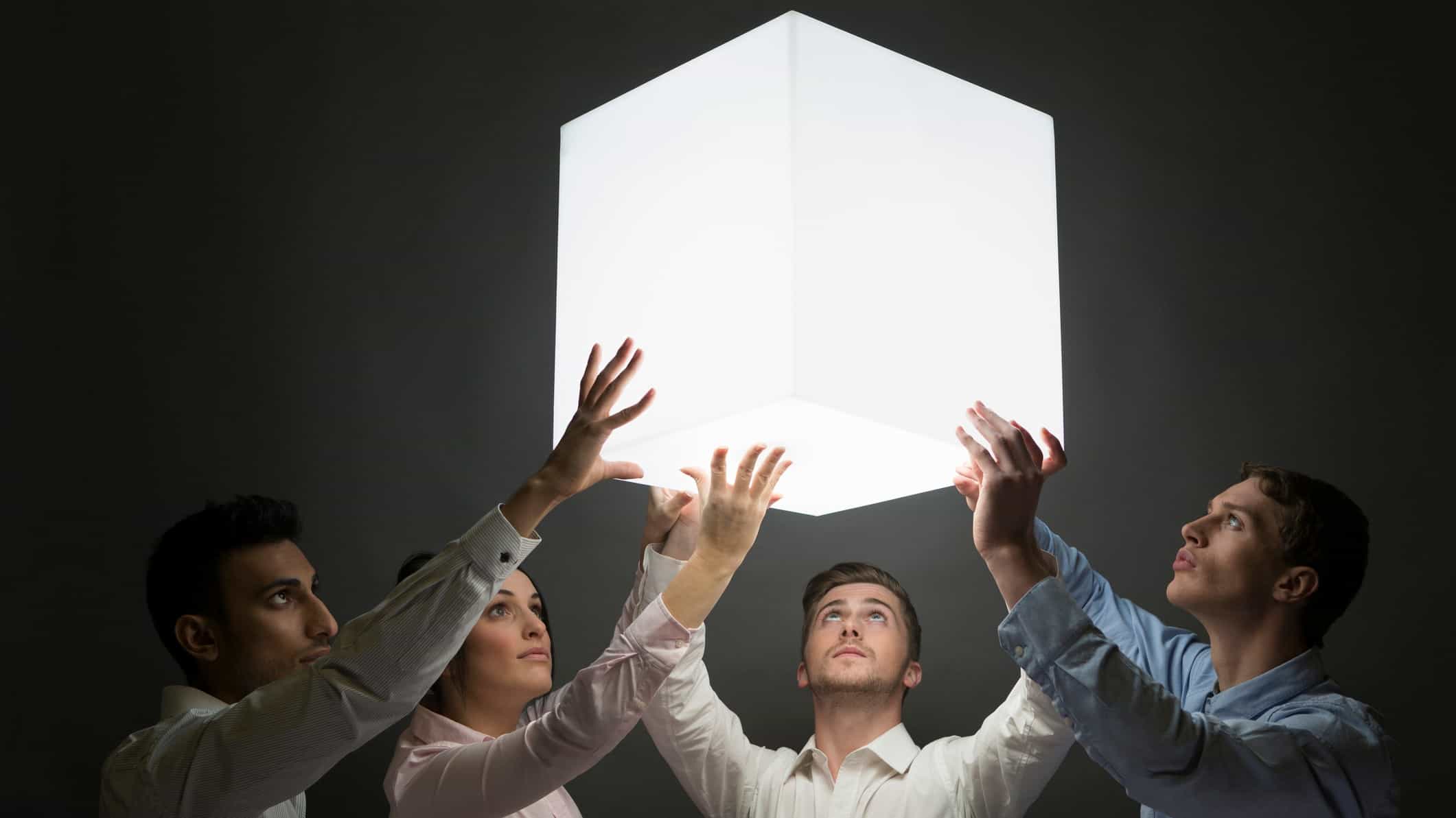 holding shares represented by group of investors holding up a square cube