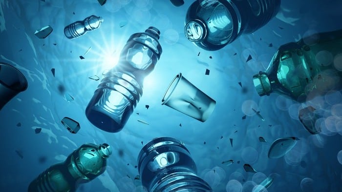 Plastic water and cola bottles floating in the sea