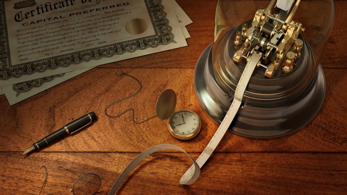 An old-fashioned stock ticker, fob watch and stock certificates