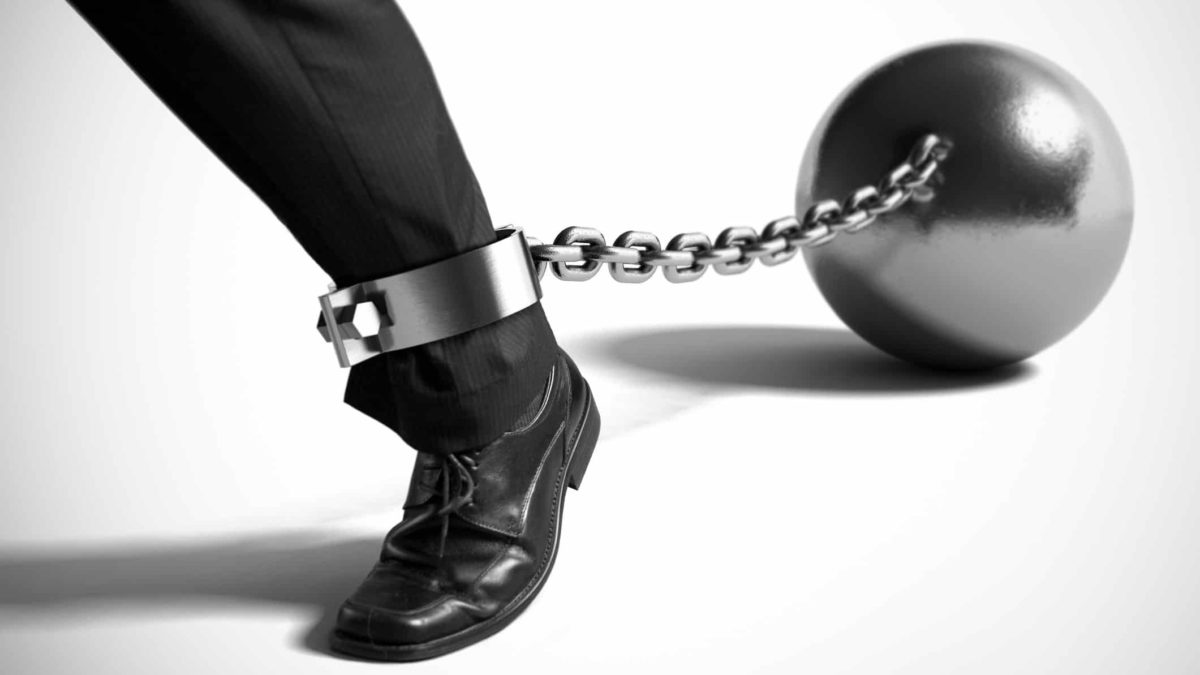 falling asx share price represented by invor's leg with ball and chain attached