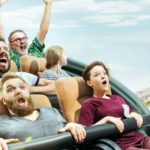 Scared looking people on a rollercoaster ride representing the volatile Mineral Resources share price in 2022