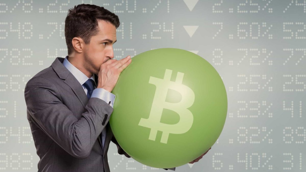Rising bitcoin price represented by man blosing up baloon with bitcoin symbol on it