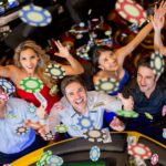 Casino players throwing chips in the air.