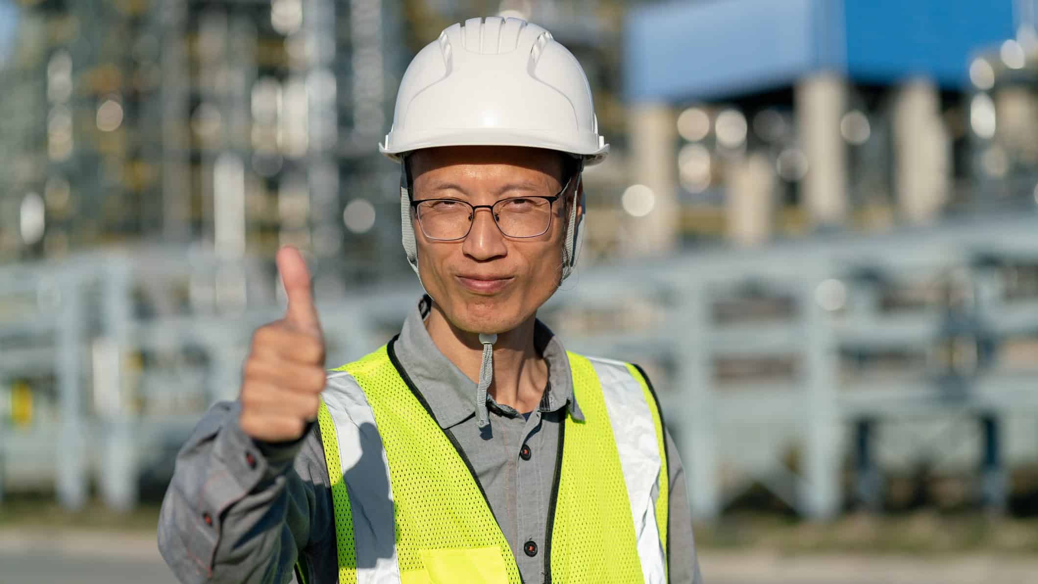 China factory worker giving thumbs up