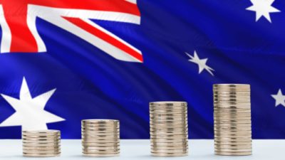 Rising asx share price represented by growing coin piles against australian flag