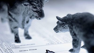 Bull and bear statue facing off over share prices