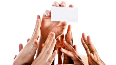 rising fintech share price represented by hands all grabbing at a credit card