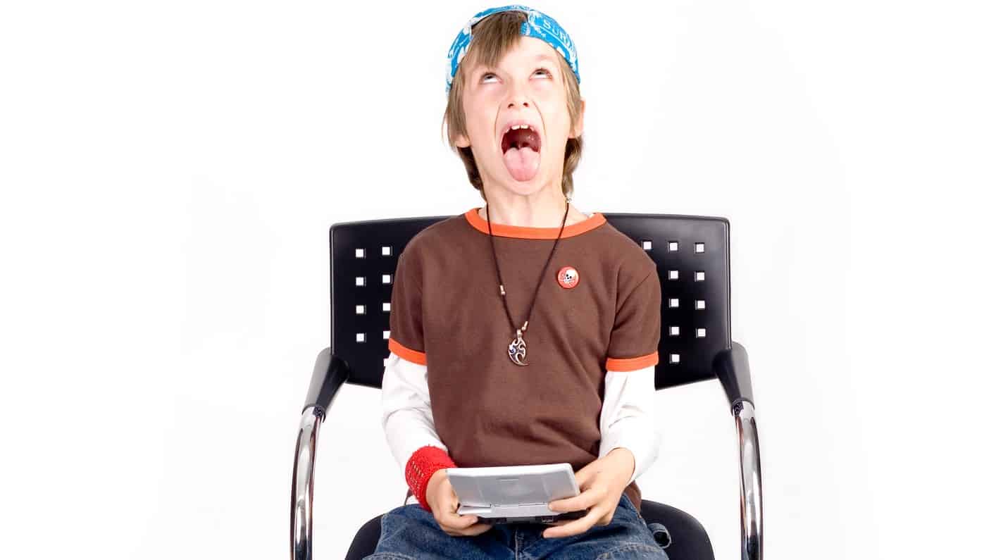 gaming asx share price fall represented by child looking frustrated while playing digital gaming device
