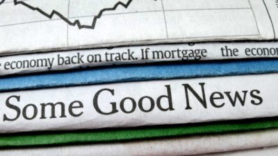 A newspaper with the words "Some good news', indicating economic and share price recovery