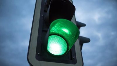 A traffic light with the green light flashing representing the BHP board moving forward with unification of corporate structure