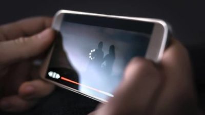person streaming video on iphone