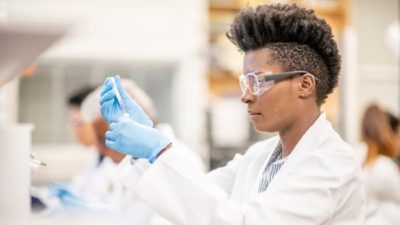 women in a lab carrying out a medical experiment