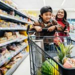 Family having fun while shopping for groceries.