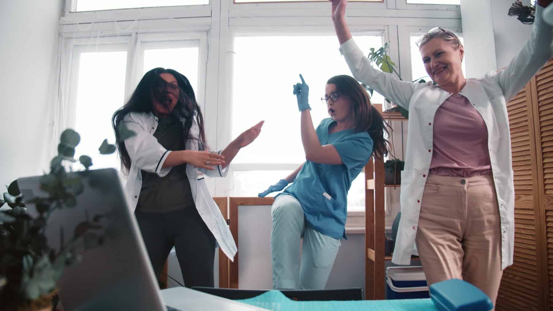 rising medical asx share price represented by excited doctors dancing in ward