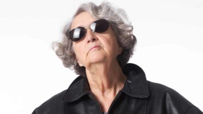 Older woman looking up as if watching asx share price