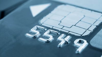 close up of 4 digits on bank card with electronic chip