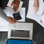 man and woman calculating financial assests