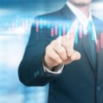 man touching a digital financial chart