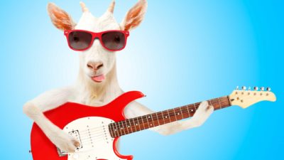 A crazy goat wearing sunglasses and playing the electric guitar, representing the unpredictable future of ASX agriculture shares