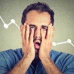 shocked man with hands over his face with a declining graph in background representing falling CleanSpace share price