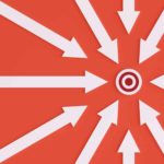 A target on a red background surrounded by white arrows pointing to it, indicated share price rises on or exceeding their target