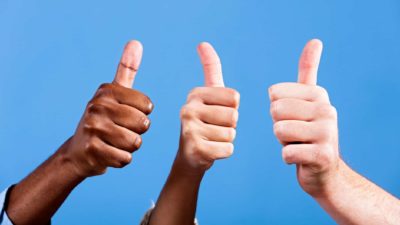 Three different hands against a blue backdrop signal thumbs up, indicating share price rise on the ASX market