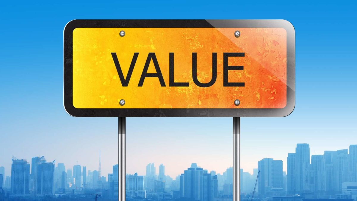 An orange sign with the word value against a blue cityscape, representing ASX value shares