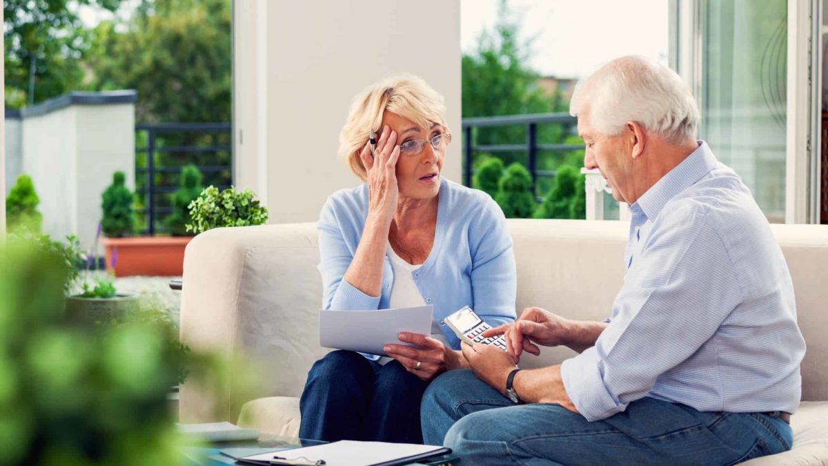 worried couple looking at their retirement savings