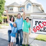 Family celebrates buying new house