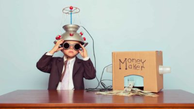 Humorous child with homemade money-making machine.